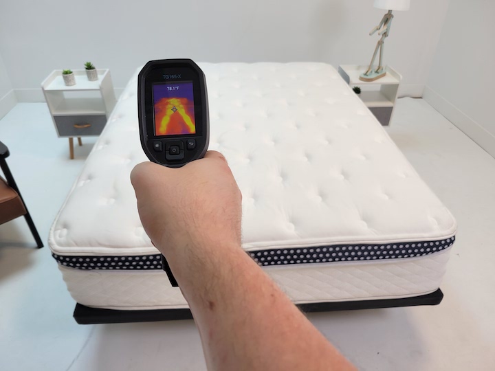 a man uses the heat gun on the WinkBed mattress