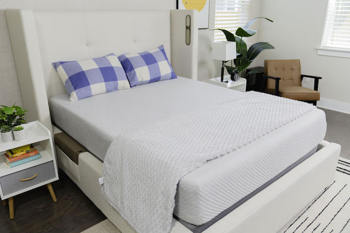 the Leesa mattress sits on top of a bed frame