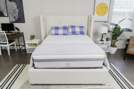 the Helix Plus mattress sits on a bed frame