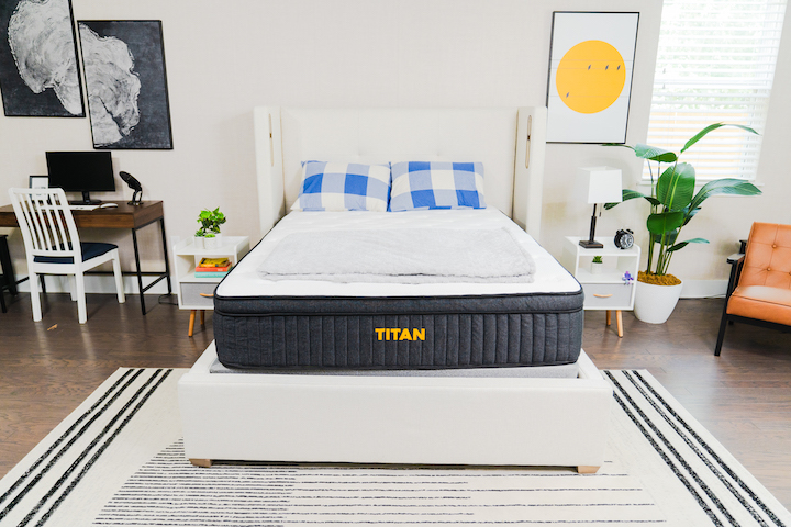 the Titan Plus mattress sits on a bed frame