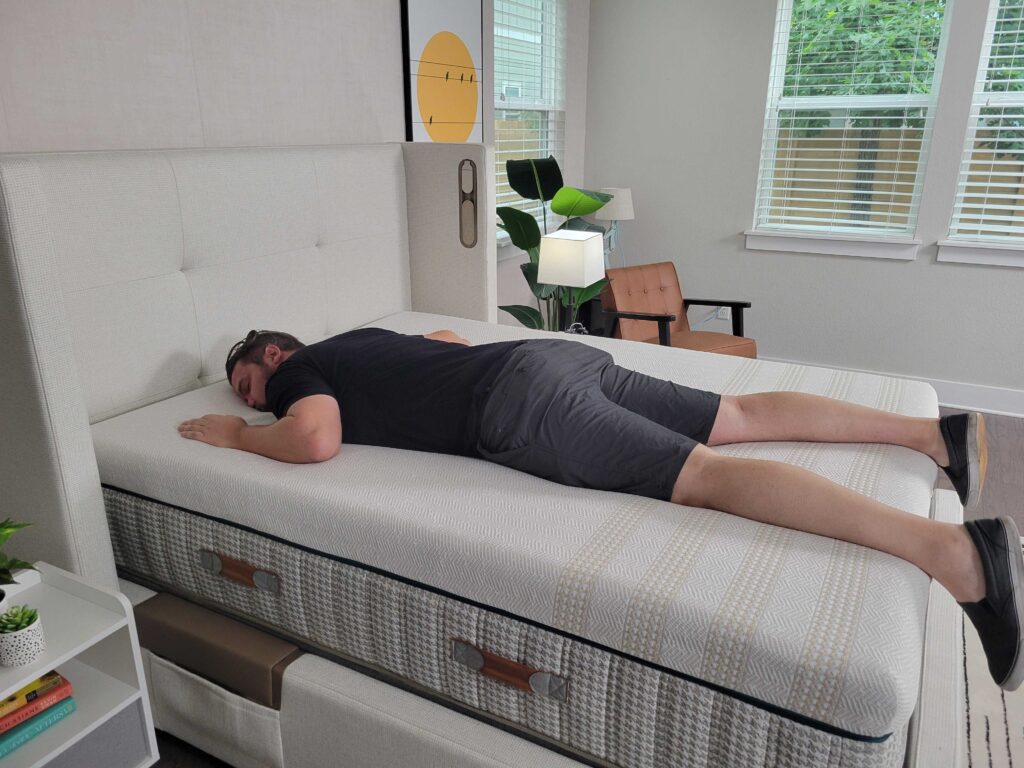 a man sleeps on his stomach on the Leesa Reserve mattress