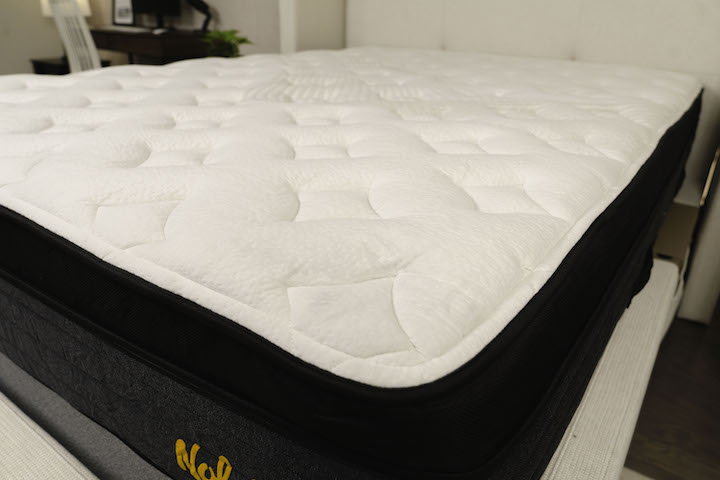 the cover of the Nolah Evolution Comfort + mattress