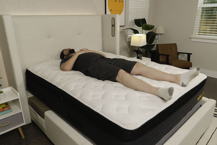 a man sleeps on his side on the Nolah Evolution Comfort + mattress