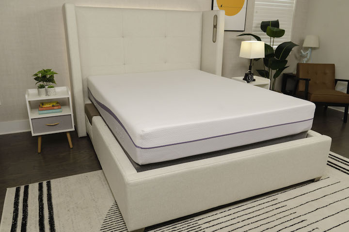 the Purple Original mattress sits on a bed frame in a bedroom