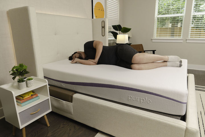 a man sleeps on his side on the Purple Original mattress