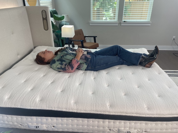 a woman sleeps on her back on the PlushBeds Signature Bliss mattress