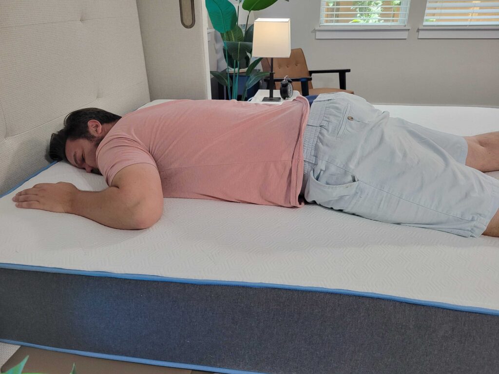 Man resting on his stomach on the Bear Original mattress