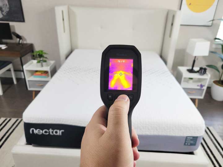 An image showing a thermal gun pointed at the Nectar Premier mattress. Its screen reads 75.1 F.